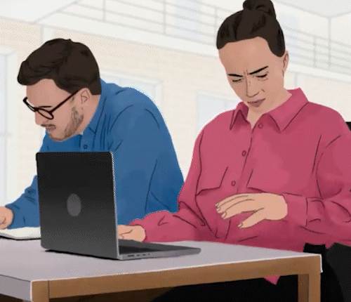 Man and woman at a desk. The woman is analyzing her hands